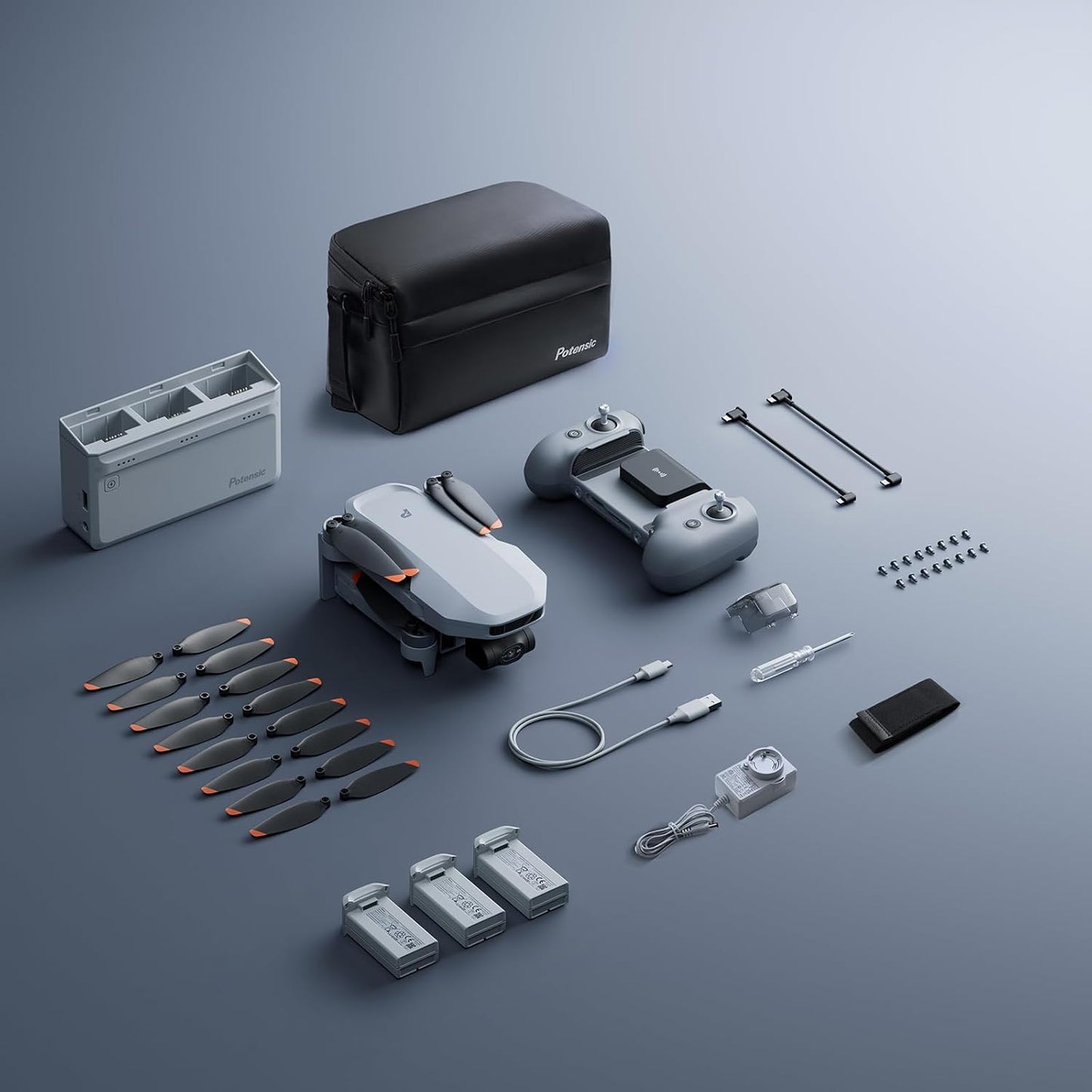 Potensic ATOM 2 Fly More Combo accessories arranged beside the folded drone