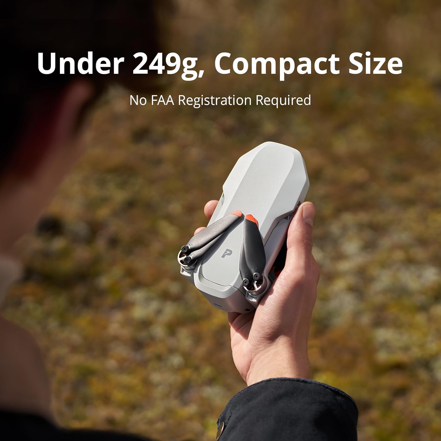 Compact Potensic ATOM 2 drone held in one hand outdoors