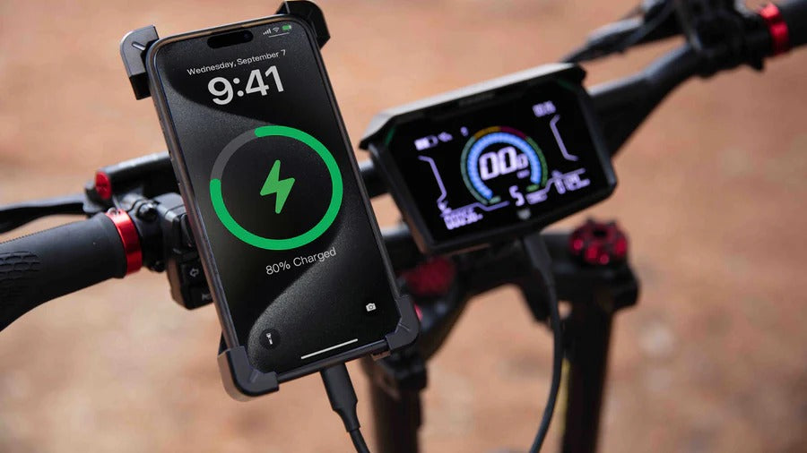 Kaabo Warrior X Max handlebar display with smartphone connected to the Type-C charging port