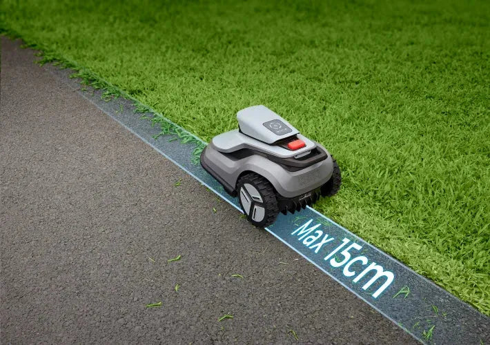 TerraMow V1000 robot lawn mower demonstrating adjustable edge cutting beside a paved path