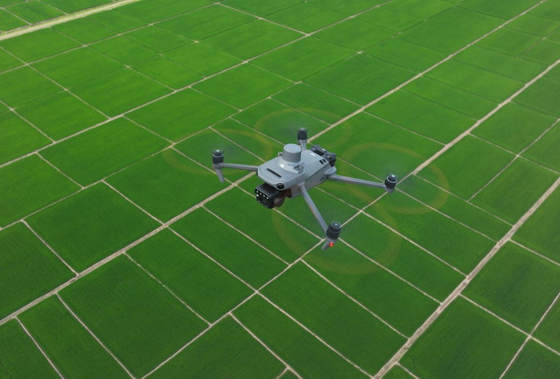 DJI Mavic 3M collecting multispectral data over mapped crop fields